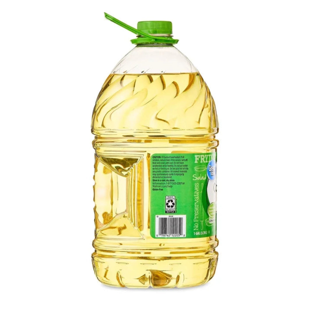 Bottle of cooking oil with a green label on a white background